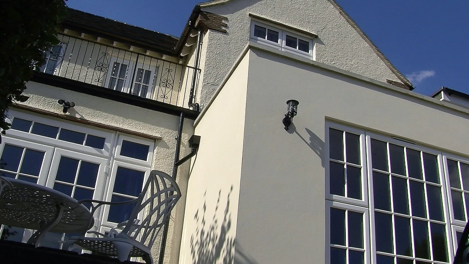 Rear elevation of the Hill Crescent house with balcony and new glazing