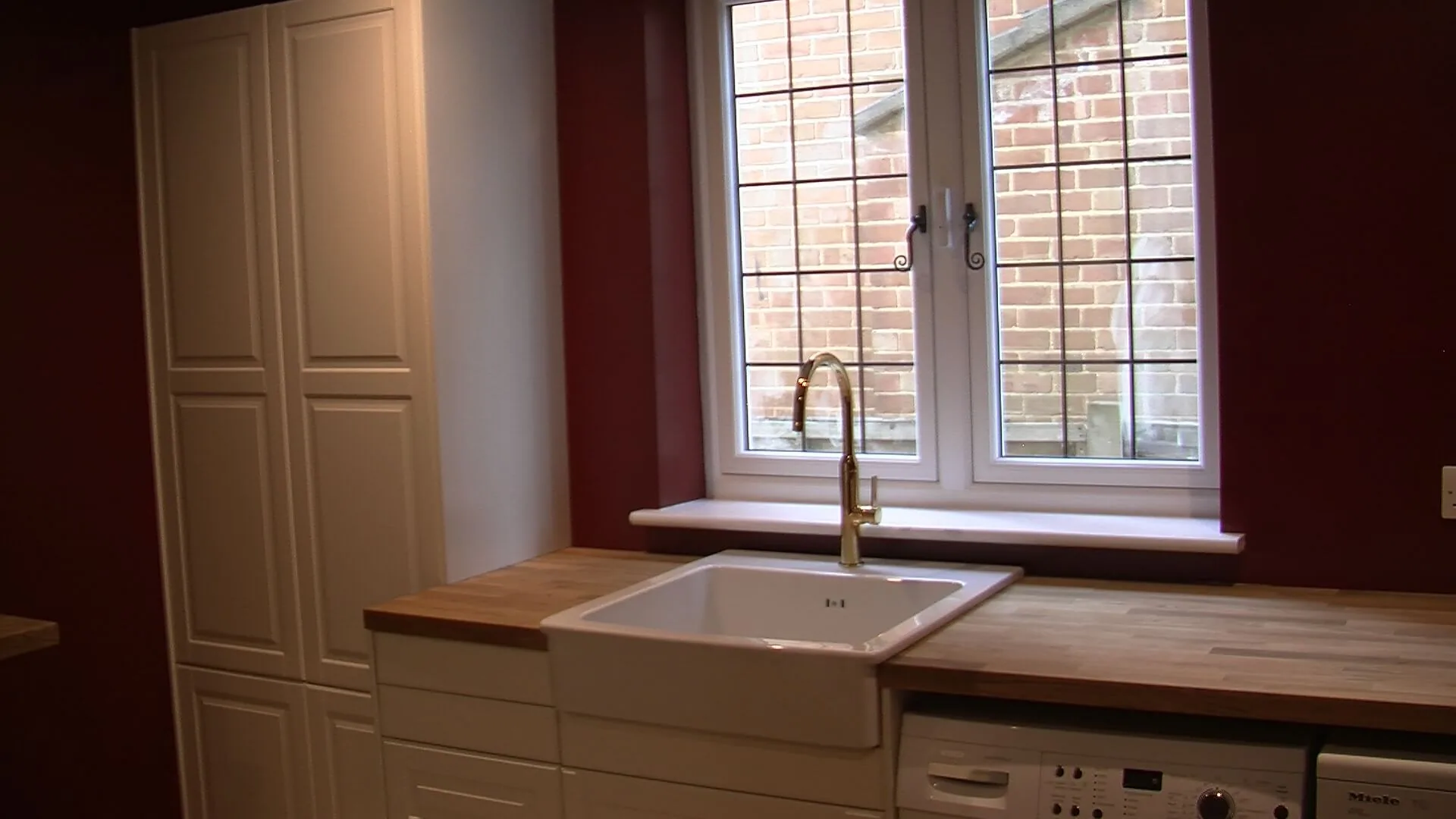 Utility room with Belfast sink and oak worktop at Hill Crescent